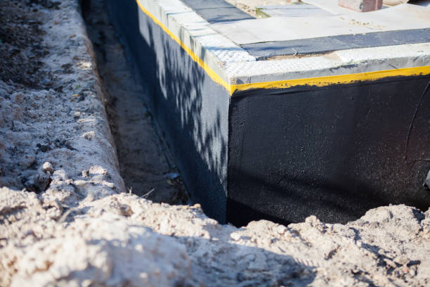 Professional Basement Waterproofing technician working in Norwood, NC